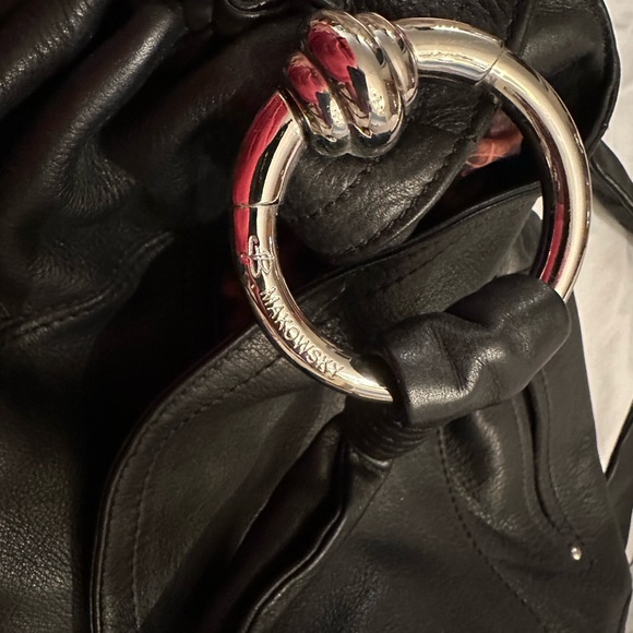 Edgy, leather shoulder bag with attitude and function - Picture 7 of 8